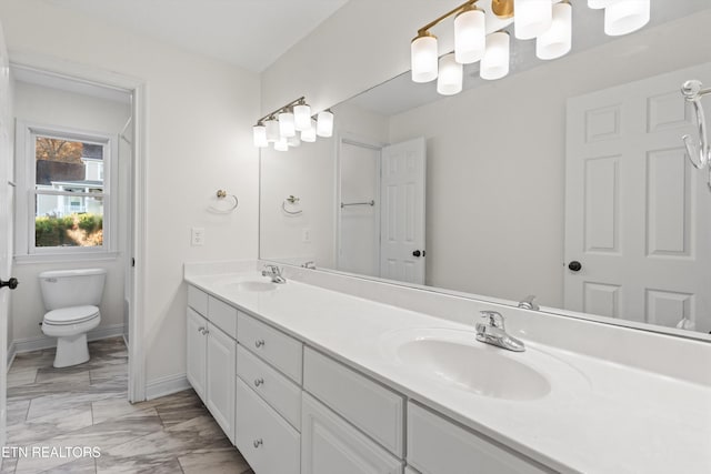 bathroom with vanity and toilet