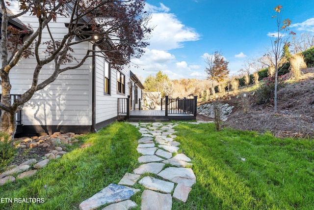 view of yard with a wooden deck