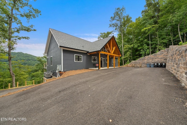 exterior space with a mountain view and central air condition unit