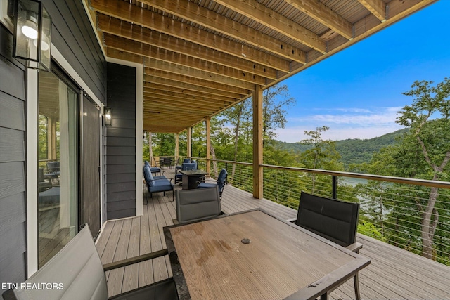 wooden terrace with a mountain view