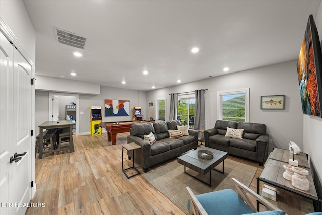 living room with billiards and light wood-type flooring