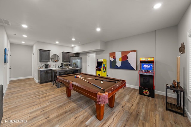 recreation room featuring pool table and light hardwood / wood-style flooring