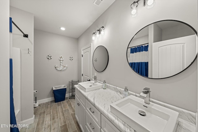 bathroom featuring vanity and hardwood / wood-style flooring