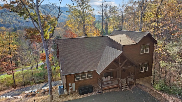 view of front of house with a mountain view and cooling unit