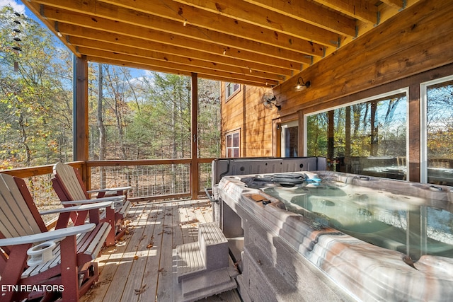 sunroom / solarium featuring a jacuzzi