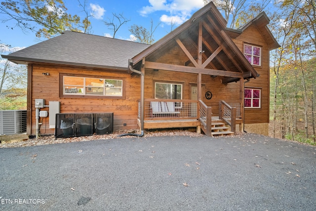 view of front facade with central air condition unit and a porch