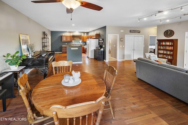 dining room featuring ceiling fan and light wood-type flooring