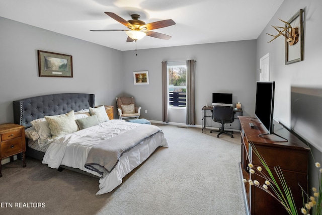 bedroom featuring ceiling fan and carpet