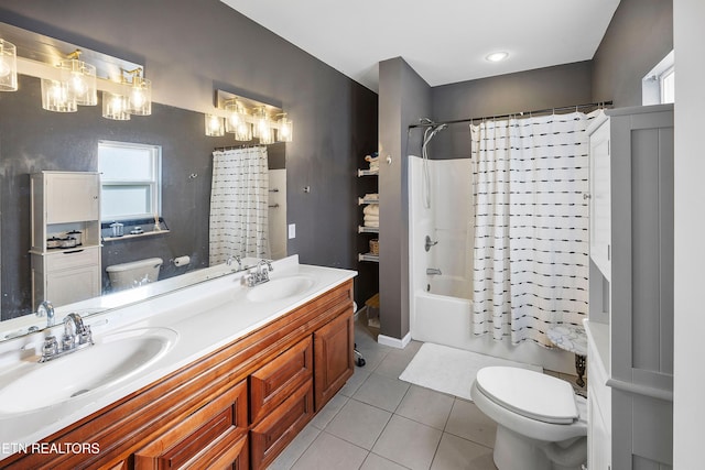 full bathroom with toilet, shower / tub combo with curtain, tile patterned floors, and vanity