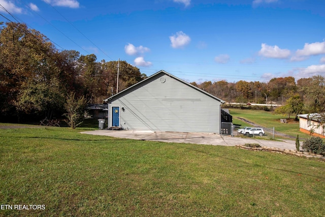 view of side of home featuring a yard