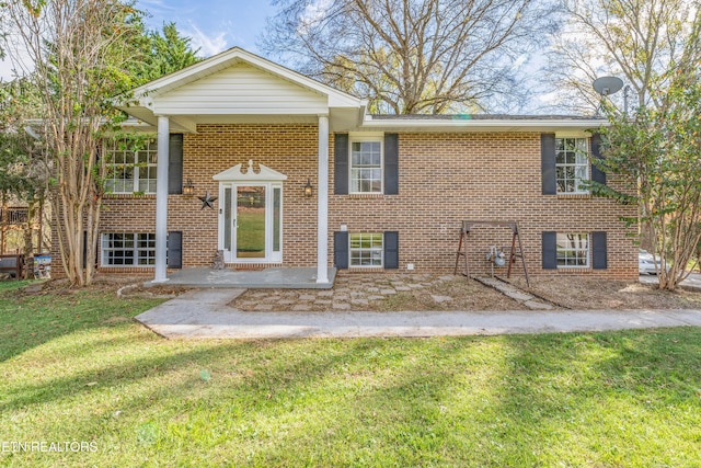 raised ranch with a front lawn