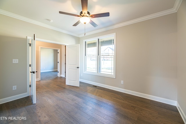 unfurnished room with ceiling fan, dark hardwood / wood-style flooring, and ornamental molding