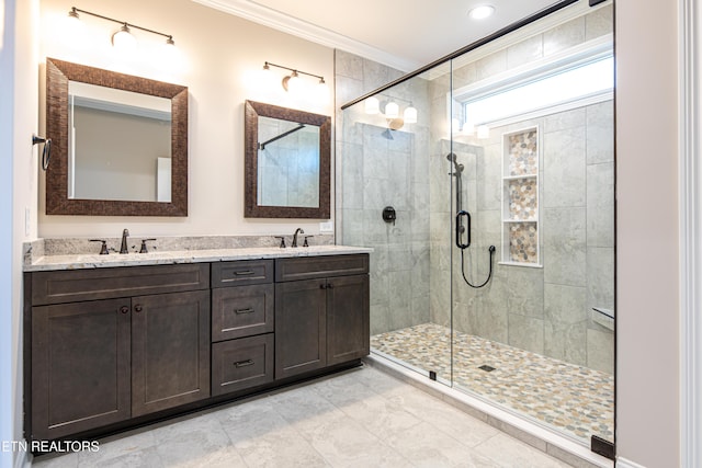 bathroom featuring crown molding, vanity, and an enclosed shower