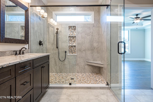 bathroom featuring a healthy amount of sunlight, wood-type flooring, and crown molding