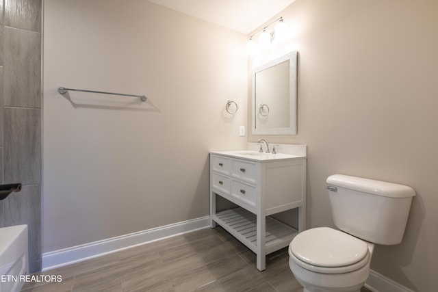 bathroom featuring vanity, toilet, and wood-type flooring