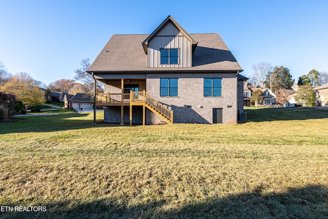 back of house featuring a yard and a deck