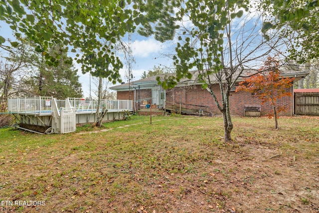 view of yard featuring a swimming pool side deck