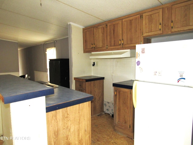 kitchen featuring white refrigerator