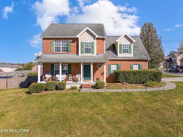 view of front of home with a front lawn and a porch