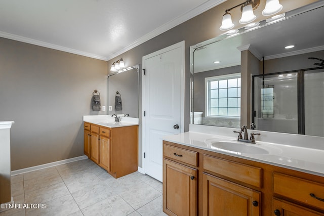 bathroom featuring tile patterned floors, crown molding, a shower with shower door, and vanity