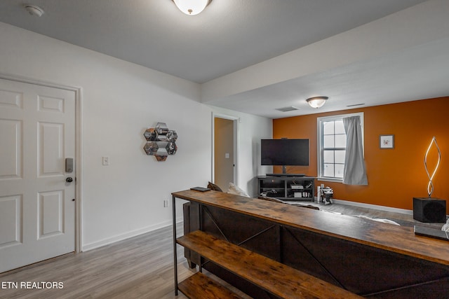 interior space featuring wood-type flooring and wood counters