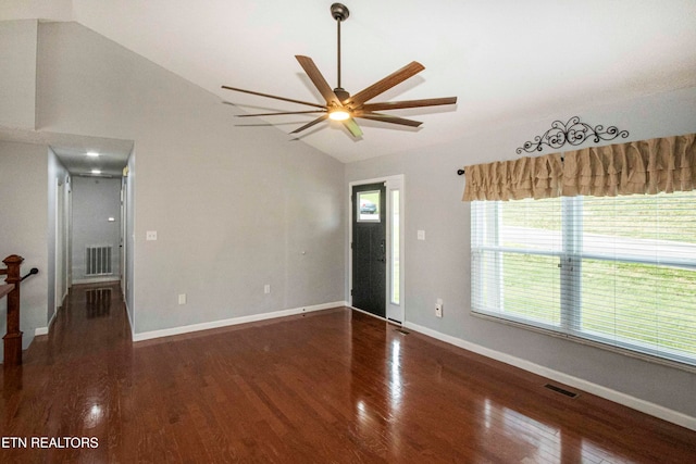 interior space with ceiling fan, dark hardwood / wood-style floors, and lofted ceiling