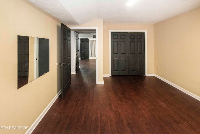 hall featuring dark wood-type flooring