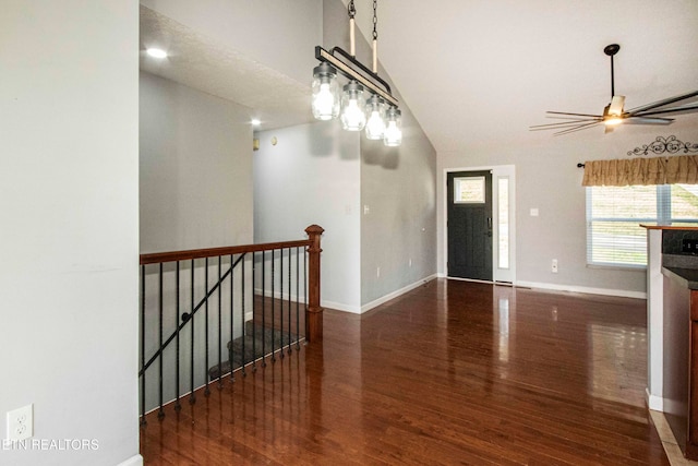 interior space with dark hardwood / wood-style flooring and lofted ceiling