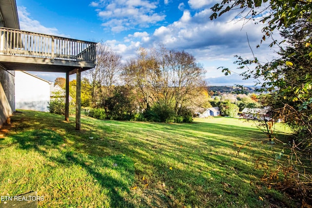 view of yard with a wooden deck