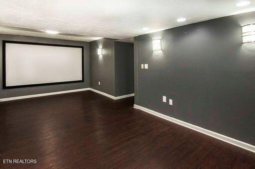 home theater featuring dark hardwood / wood-style flooring