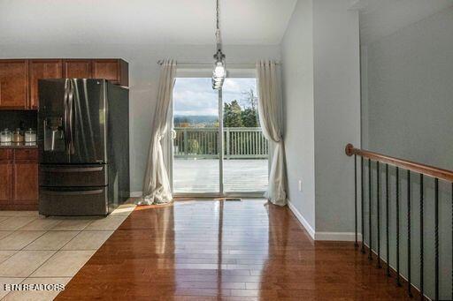 unfurnished dining area featuring light hardwood / wood-style flooring