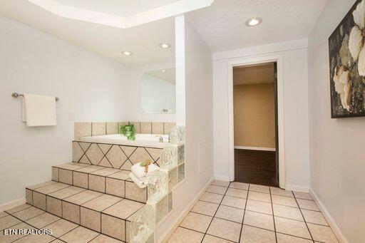 hallway with light tile patterned floors