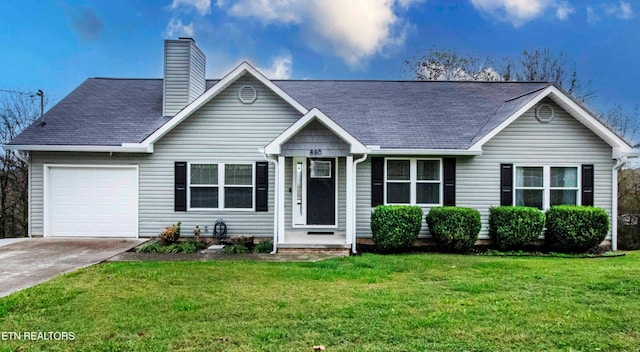 view of front of property with a front lawn and a garage