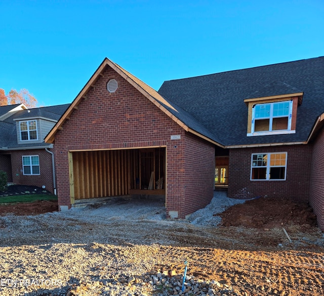 view of side of property with a garage