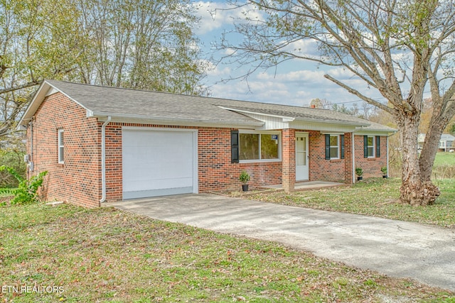 ranch-style house with a front yard and a garage