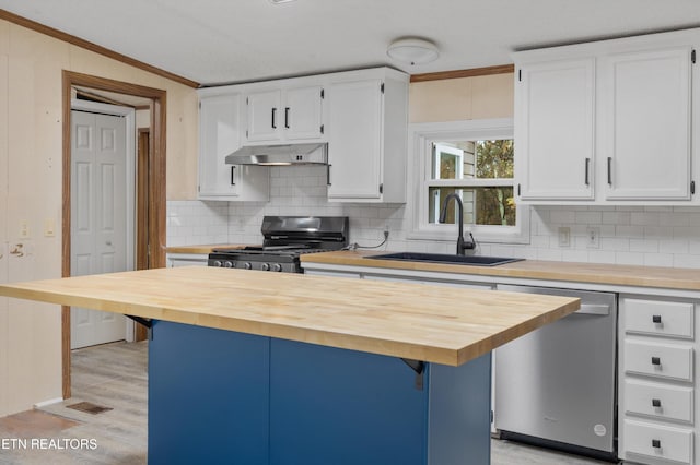 kitchen with butcher block countertops, black gas stove, white cabinetry, and stainless steel dishwasher