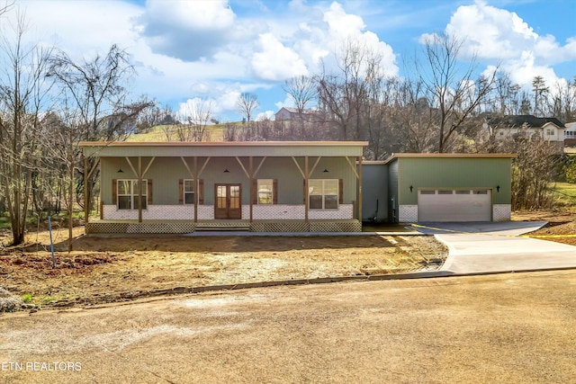 view of front facade with a porch and a garage