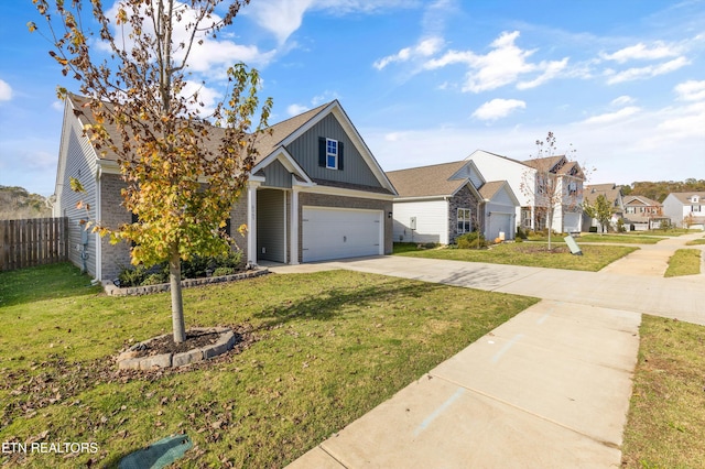 view of front of property featuring a front lawn and a garage