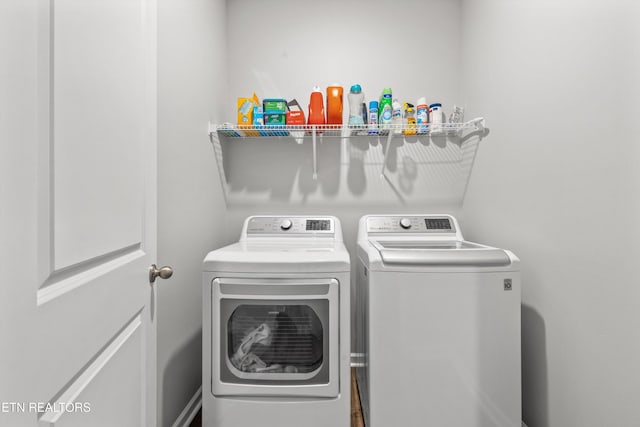 laundry area with separate washer and dryer