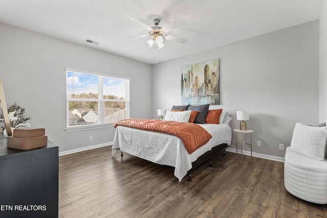 bedroom featuring ceiling fan and dark wood-type flooring