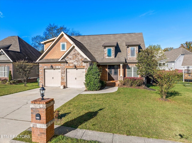 view of front of home featuring a front yard and a garage