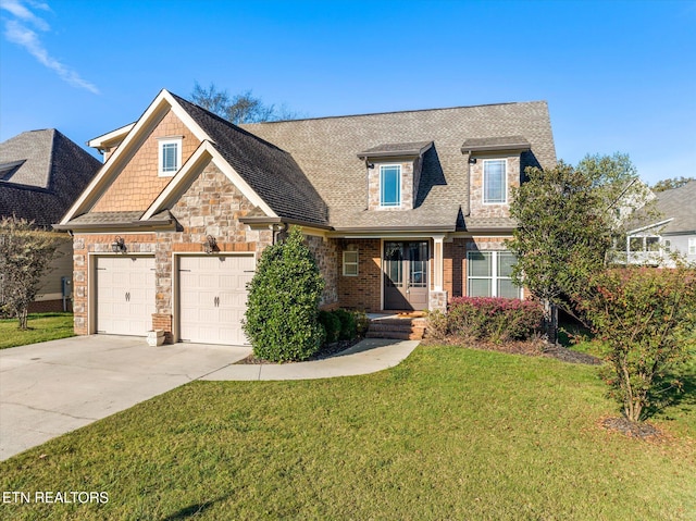 view of front of house featuring a front yard and a garage