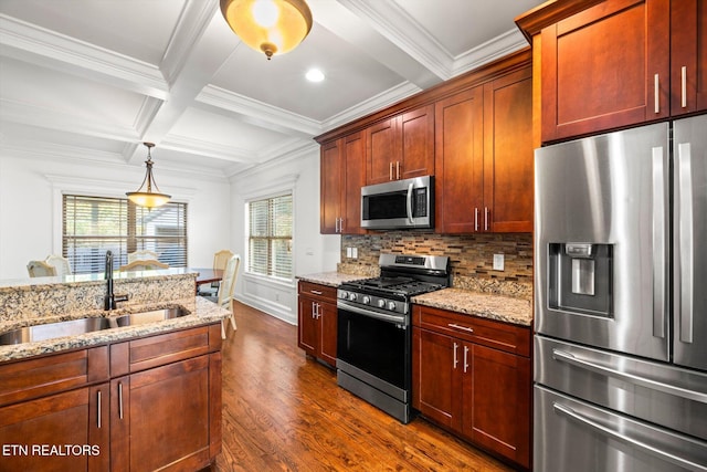 kitchen with light stone countertops, appliances with stainless steel finishes, dark wood-type flooring, and sink