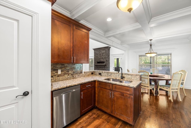 kitchen with dishwasher, dark hardwood / wood-style flooring, sink, and decorative light fixtures