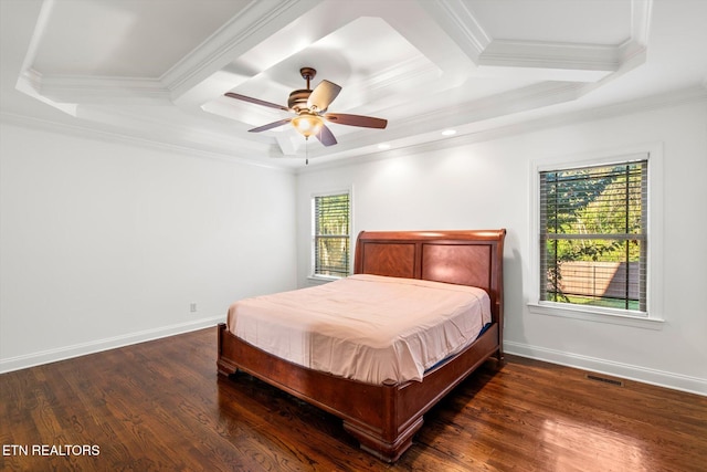 bedroom featuring dark hardwood / wood-style floors, ornamental molding, and multiple windows