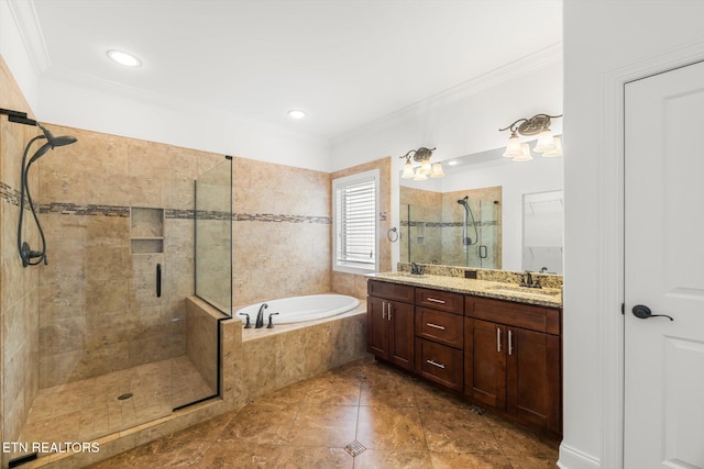 bathroom with plus walk in shower, vanity, and ornamental molding