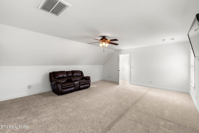 additional living space featuring ceiling fan, lofted ceiling, and light carpet