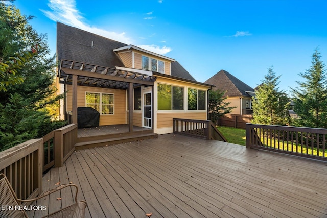 wooden deck featuring a pergola