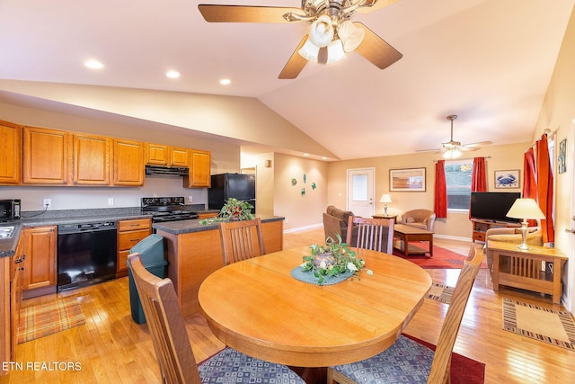 dining room with ceiling fan, lofted ceiling, and light hardwood / wood-style floors