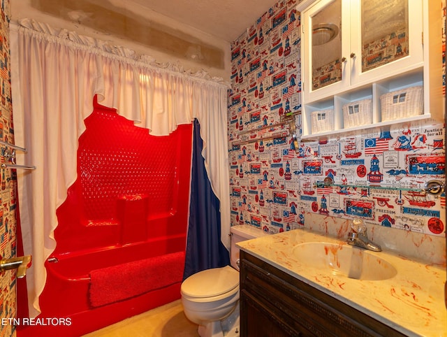 bathroom with vanity, curtained shower, toilet, and a textured ceiling